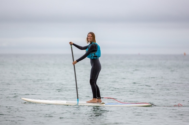 woman on surf board in sea