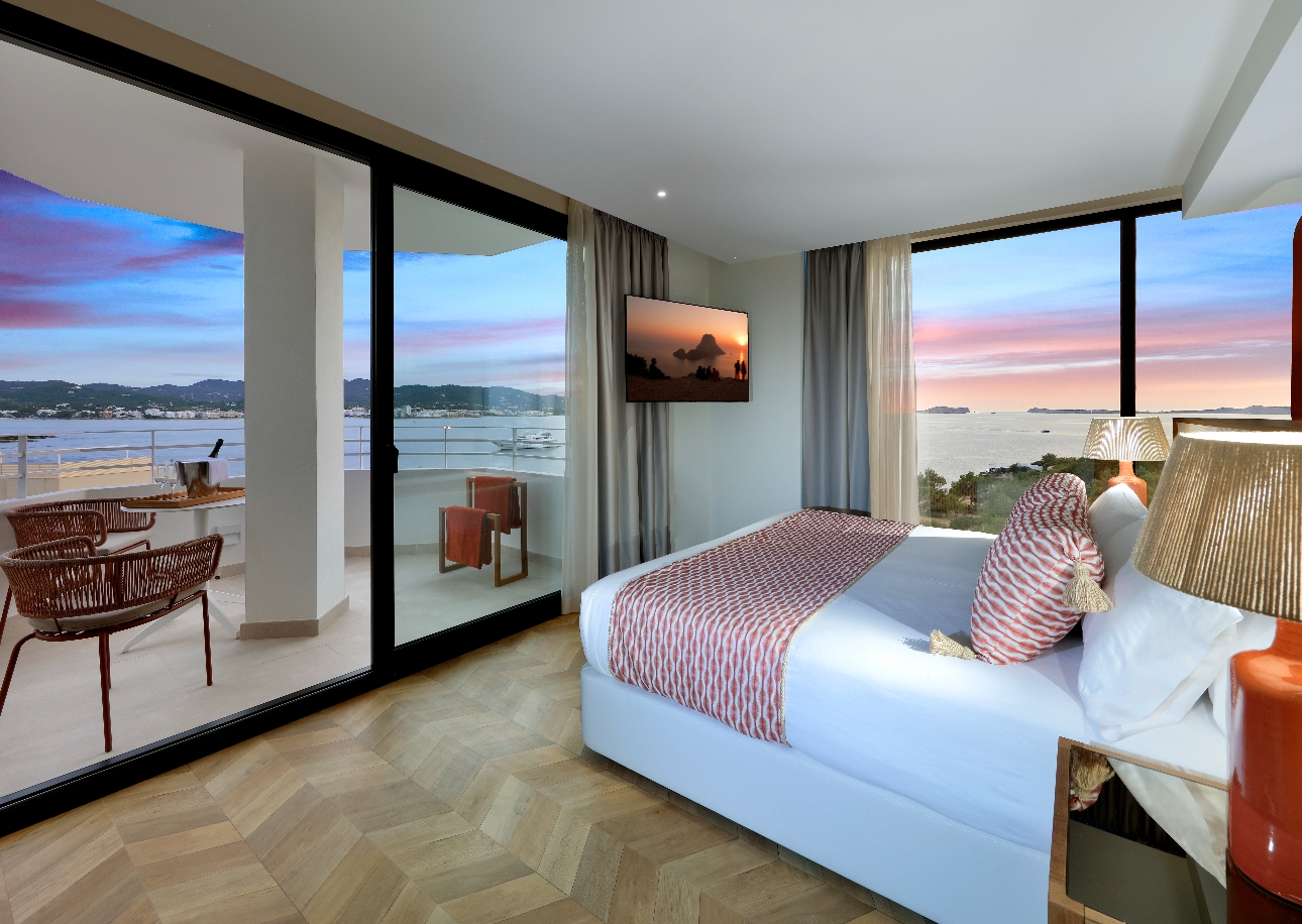 bedroom view at night with balcony