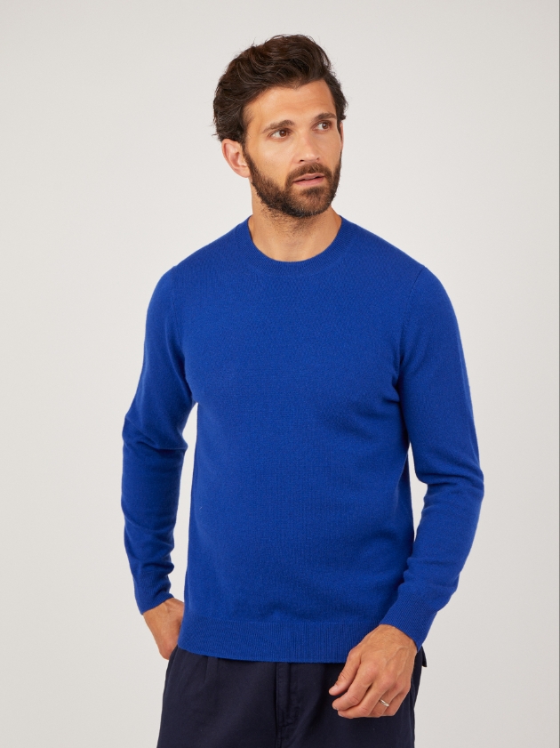 A man wearing a blue jumper